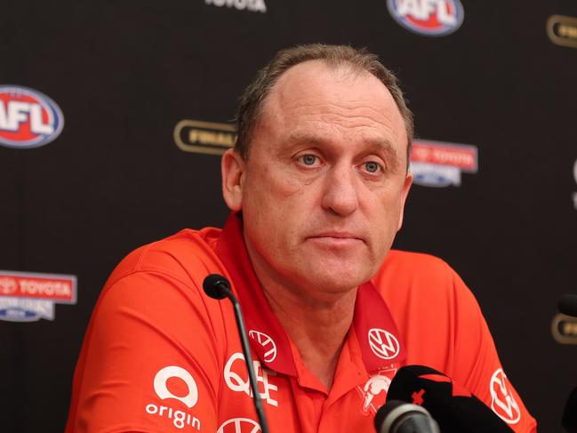 MELBOURNE, AUSTRALIA - SEPTEMBER 28: John Longmire, Senior Coach of the Swans speaks to the media after the AFL Grand Final match between Sydney Swans and Brisbane Lions at Melbourne Cricket Ground, on September 28, 2024, in Melbourne, Australia. (Photo by Robert Cianflone/AFL Photos via Getty Images)