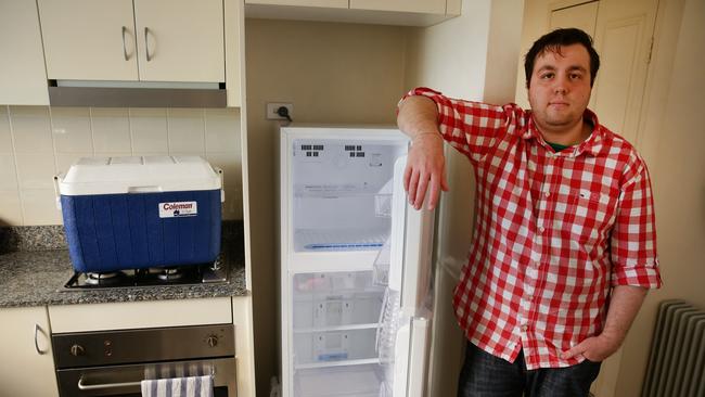 Andrew Burkett and his broken LG fridge / Picture: Cameron Richardson