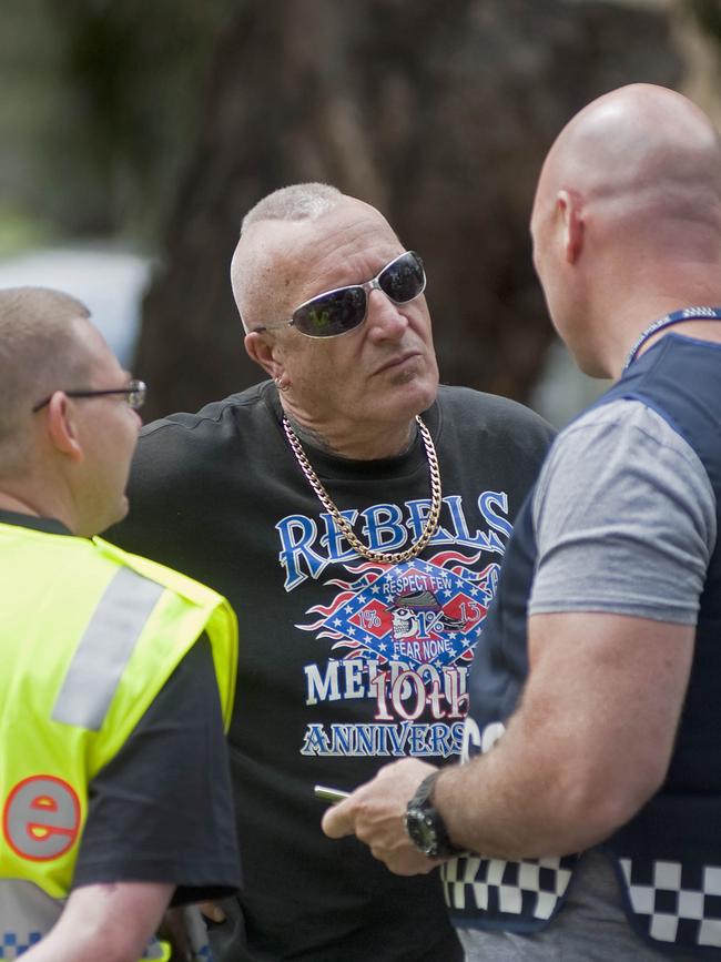 Geelong Rebels president Colin Websdale talks to cops near Wedderburn.