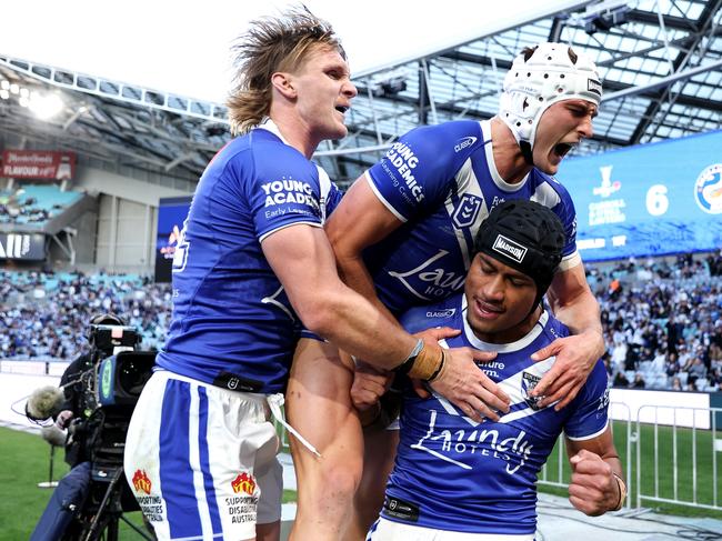 Stephen Crichton of the Bulldogs celebrates with team mates after scoring a try. Picture:Brendon Thorne/Getty Images