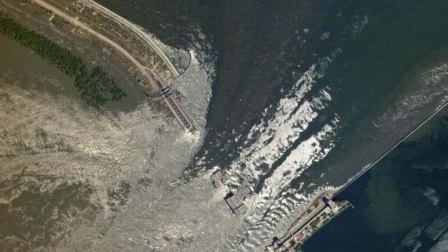 Water surges through the damaged Nova Kakhovka dam on Tuesday. Planet Labs via AFP