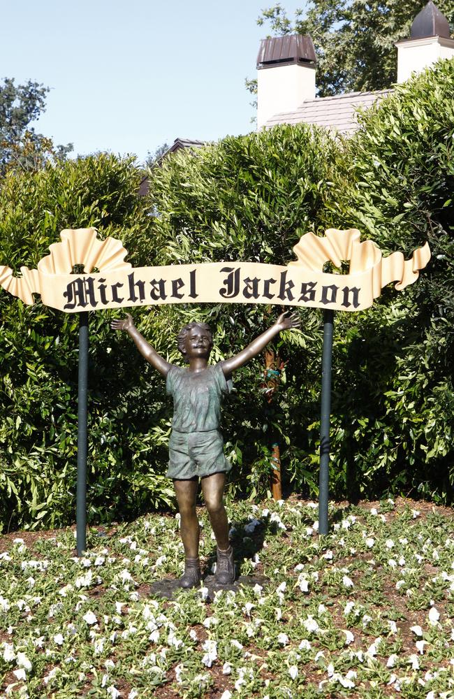 A statue of a young child stands near a Michael Jackson sign on the Neverland Ranch. Picture: Trae Patton/NBC/NBCU Photo Bank/Getty Images 