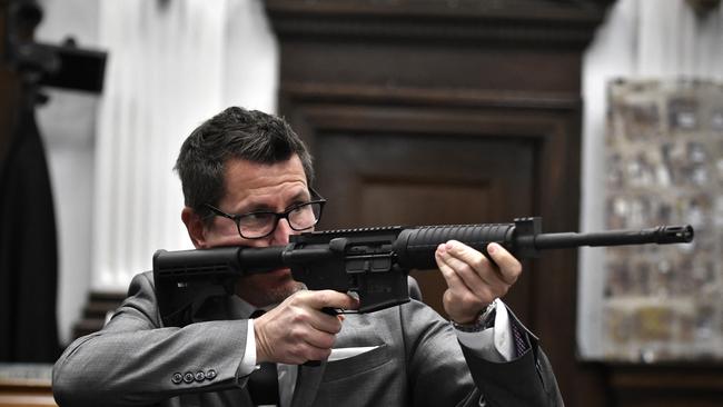 Assistant District lawyer Thomas Binger holds Kyle Rittenhouse's gun as he gives the state's closing argument in Rittenhouse's trial. Picture: Sean Krajacic-Pool/Getty Images/AFP