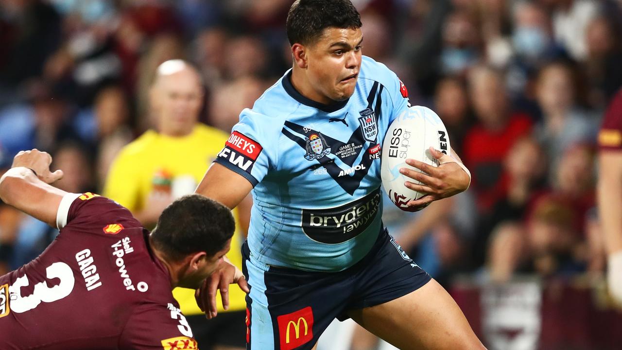 GOLD COAST, AUSTRALIA - JULY 14: Latrell Mitchell of the Blues puts a fend on Dane Gagai of the Maroons during game three of the 2021 State of Origin Series between the New South Wales Blues and the Queensland Maroons at Cbus Super Stadium on July 14, 2021 in Gold Coast, Australia. (Photo by Chris Hyde/Getty Images)