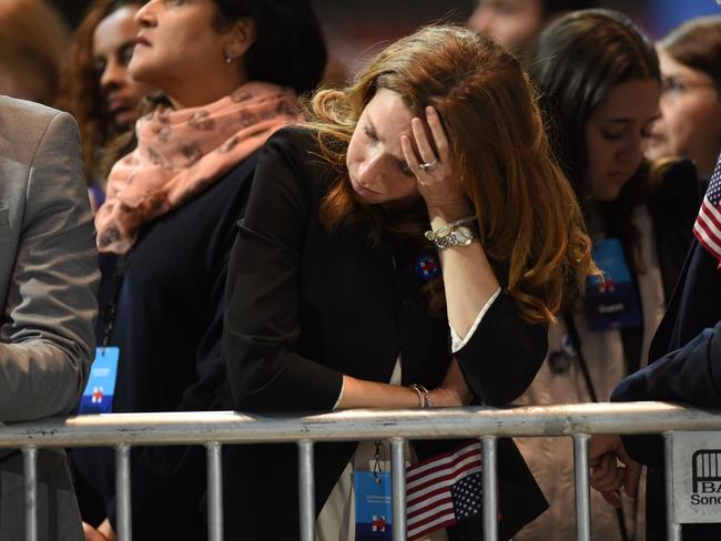 A supporter of US Democratic presidential nominee Hillary Clinton reacts as elections returns are reported during election night at the Jacob K. Javits Convention Center in New York on November 8, 2016. Clinton will hold her election night event at the convention center. / AFP PHOTO / Don EMMERT