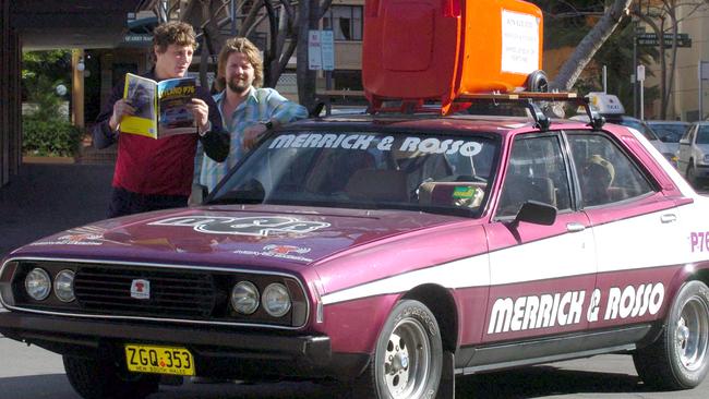 2004: Radio announcers Merrick and Rosso embrace the Leyland P76 as their program’s vehicle of choice during their days at Nova in Sydney. Picture: Jim Trifyllis 