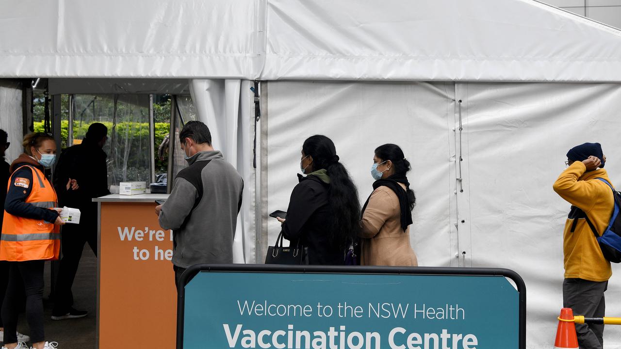 People line up to receive their COVID-19 vaccination at the NSW Health Vaccination hub in Sydney. Picture: NCA NewsWire/Bianca De Marchi