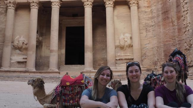Alexis (centre) with a few friends but no crowds outside The Treasury in Petra, Jordan. Picture: Alexis Carey.