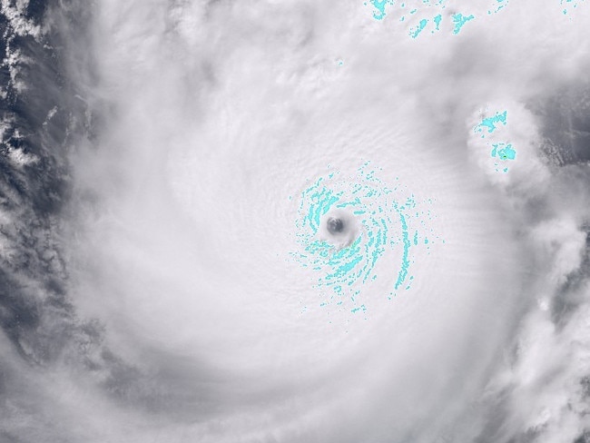 In this satellite image courtesy of the European Space Agency Sentinel Hub taken on October 7, 2024, the pinhole eye of Hurricane Milton can be seen over the Gulf of Mexico. Hurricane Milton exploded in strength Monday to become a potentially catastrophic Category 5 storm bound for Florida, threatening the US state with a second ferocious hurricane in as many weeks. (Photo by HANDOUT / EUROPEAN SPACE AGENCY / AFP) / RESTRICTED TO EDITORIAL USE - MANDATORY CREDIT "AFP PHOTO / EUROPEAN SPACE AGENCY / SENTINEL HUB" - NO MARKETING NO ADVERTISING CAMPAIGNS - DISTRIBUTED AS A SERVICE TO CLIENTS