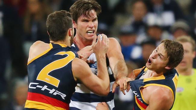 GEELONG, AUSTRALIA — JUNE 02: Matt Crouch of the Crows reacts while wrestling against Tom Hawkins of the Cats during the round 11 AFL match between the Geelong Cats and the Adelaide Crows at Simonds Stadium on June 2, 2017 in Geelong, Australia. (Photo by Michael Dodge/Getty Images)