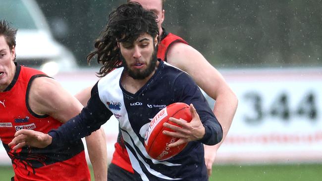 Adam Tomac in action for Melton Centrals. Picture: Hamish Blair