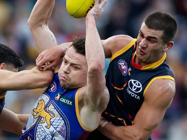 BRISBANE, AUSTRALIA - JULY 07: Lachie Neale of the Lions marks the ball during the 2024 AFL Round 17 match between the Brisbane Lions and the Adelaide Crows at The Gabba on July 07, 2024 in Brisbane, Australia. (Photo by Russell Freeman/AFL Photos via Getty Images)