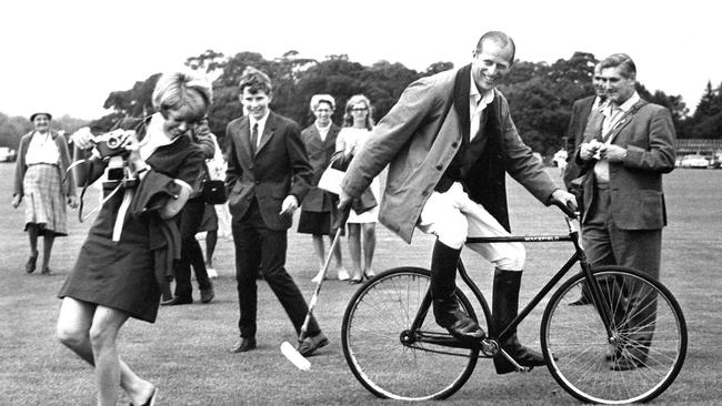 News cycle: Prince Philip, Duke of Edinburgh shows his mischievous sense of humour with a spot of bicycle polo at Windsor Great Park, Berkshire, 1964. Picture: Getty