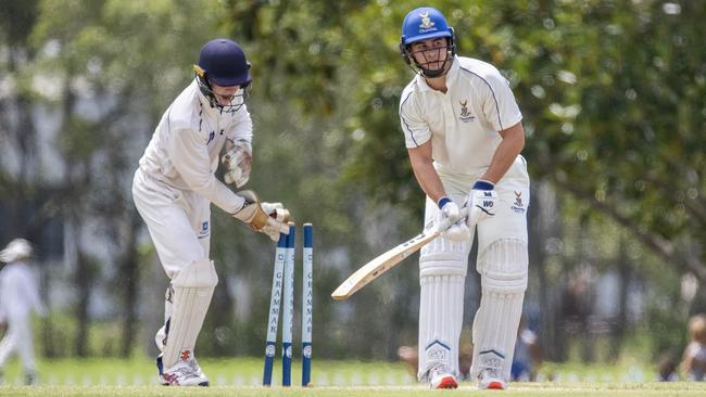 Brisbane Grammar keeper Matthew Lockhart attempts a stumping of Jessie Sia. (AAP Image/Richard Walker)