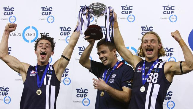 James Worpel (right) celebrates Geelong Falcons’ TAC Cup premiership with coach Daniel O'Keefe and co-captain Cooper Stephens. Picture: Graham Denholm/AFL Media.