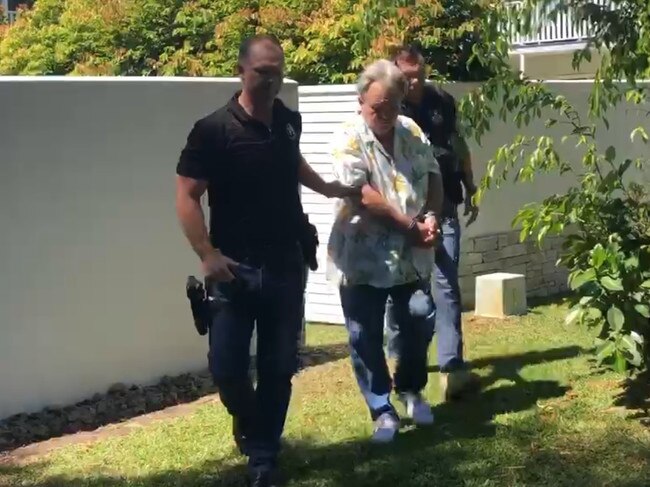 Peter Foster is escorted from his Port Douglas holiday home after his arrest. VIDEO: Mark Murray