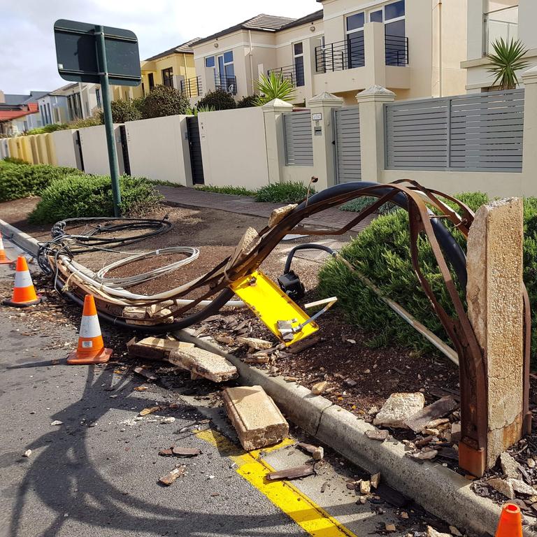 A stobie pole blown over in the strong winds last night at Henley Beach. Picture: Con Polychronis