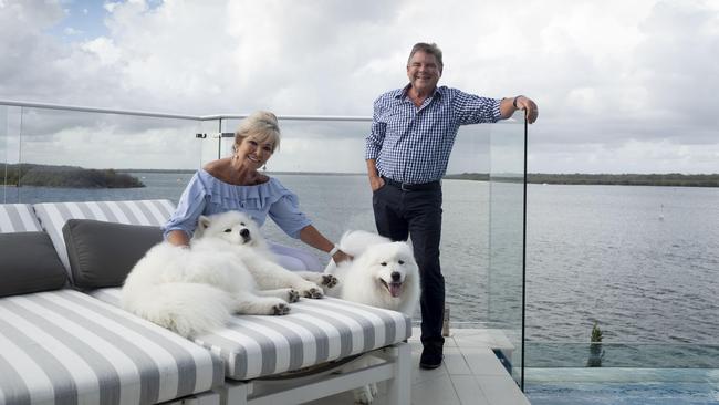 Karen and Barry Plant with their samoyeds Friday and Tiley at their Gold Coast home. Picture: Russell Shakespeare