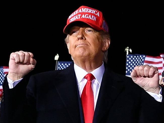 US President Donald Trump gestures during a rally at Southern Wisconsin Regional Airport in Janesville, Wisconsin on October 17, 2020. (Photo by MANDEL NGAN / AFP)