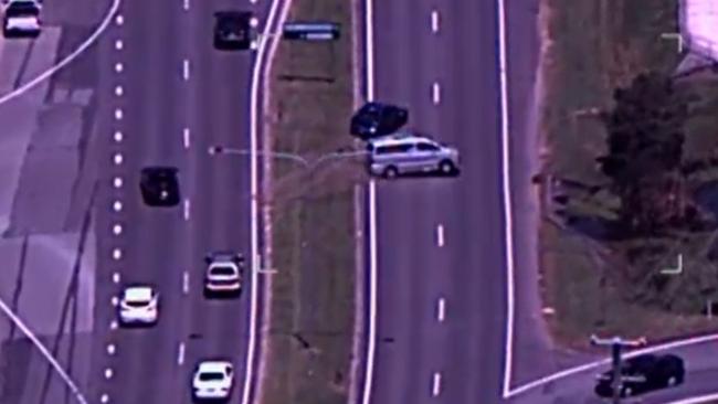 Polair footage of the chase in which the stolen car (top right), forces another car off the road after crossing a median strip.