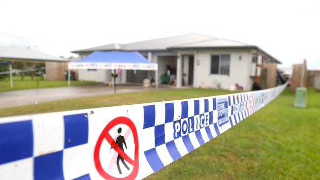 The Scullen Ave address was taped off with evidence markers identifying points of interest on the driveway and leading into the house and backyard after a woman was allegedly stabbed to death on Friday. Picture: Peter Carruthers