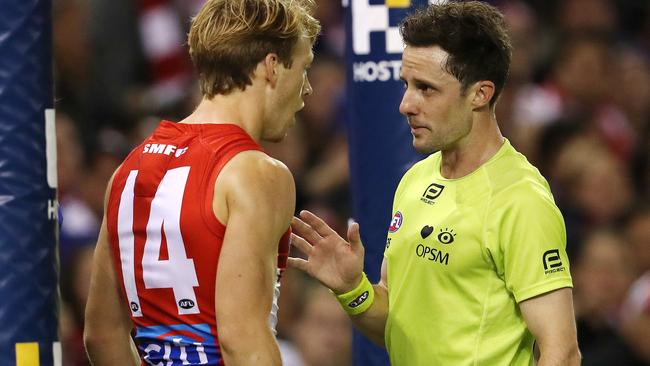 Callum Mills argues with the umpire after being penalised for deliberately rushing a behind. Picture: Michael Klein