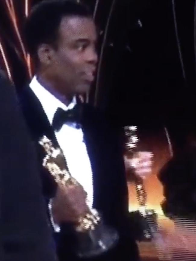 Chris Rock had to stay on stage in the moments after the altercation with Will Smith.