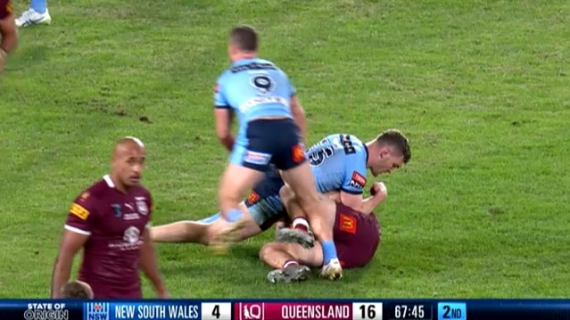 Liam Martin with an elbow into the ribs of Cameron Munster during Origin I.