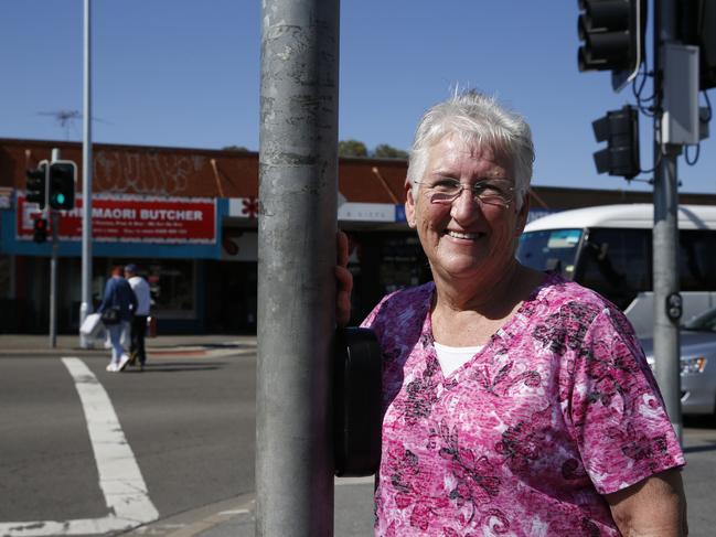 Jackie Greenow with female pedestrian crossing light created in her honour.