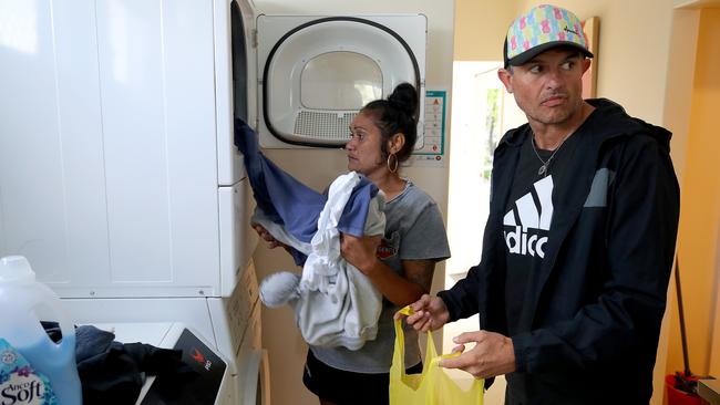 Nellie Bennett and partner Brett McKay do their washing at Pete’s Place. Picture: Toby Zerna