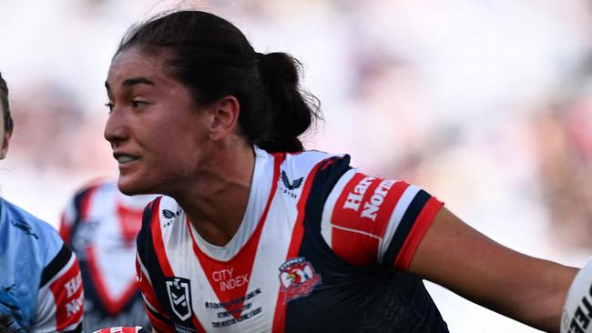 Sydney Roosters' Olivia Kernick (R) is tackled during the National Rugby League (NRL) Women's Grand Final match between Sydney Roosters and Cronulla Sharks at Accor Stadium in Sydney on October 6, 2024. (Photo by Izhar KHAN / AFP) / -- IMAGE RESTRICTED TO EDITORIAL USE - STRICTLY NO COMMERCIAL USE --