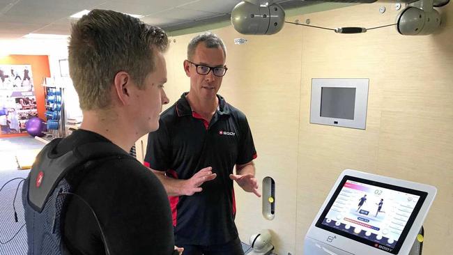 FITNESS: XBody Australia director and Summit Fitness owner Matt George with Northern Star journalist Harrison Astbury, demonstrating the new Electro-Muscular Stimulus (EMS) technology now available in the area. Picture: Javier Encalada