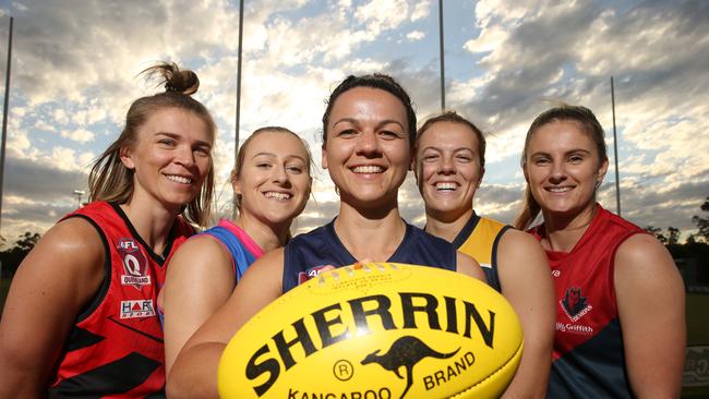 Gold Coast female Aussie rules teams are rearing to go. Left to right they are, Lauren Theodore Burleigh Bombers, Ellie Parker Robina Roos, Beth McLaughlin Broadbeach Cats, Molly Ritson Bond University, Olivia Salter Surfers Paradise Demonettes. Picture Glenn Hampson