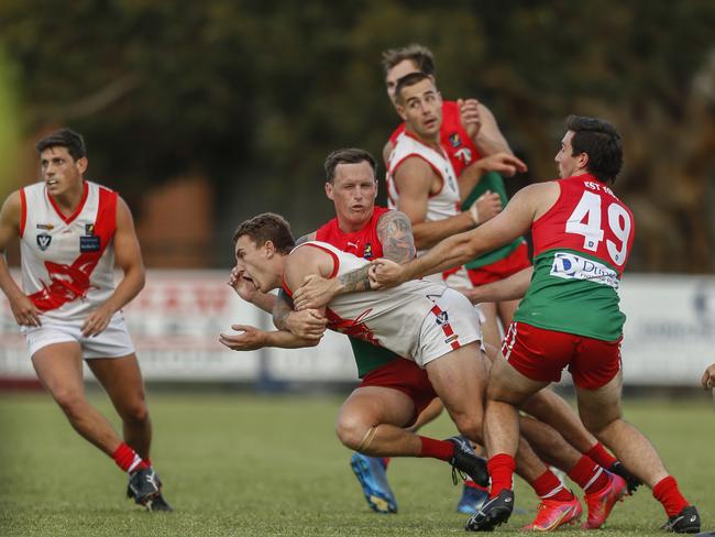 Sorrento’s Shannon Gladman fires out a handball against Pines. Picture: Valeriu Campan