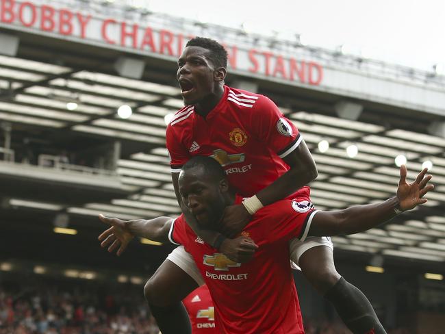 Manchester United's Romelu Lukaku celebrates scoring his side's second goal of the game with Paul Pogba (top).