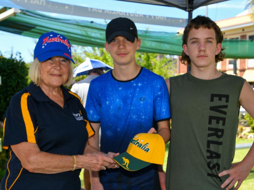 Australia Day celebrations: Rotary Club of Lismore networking member Zell Benette hands out a cap and flag to Lismore's Stellan Gampenoff and Josh Larkin at the Lismore City Bowlo.