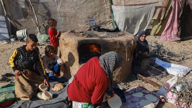 People are using salvaged materials for shelter or sleeping in the elements as winter sets in. Picture: Mohammed Abed/AFP/Getty Images