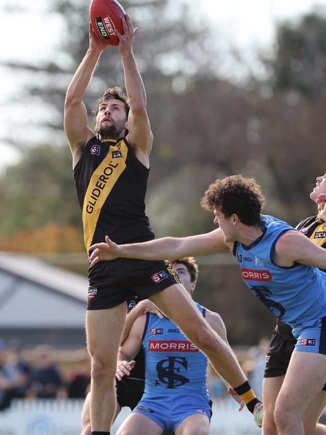 Glenelg’s Max Proud marks strongly against Sturt at the Bay in Round 9. Picture: David Mariuz/SANFL