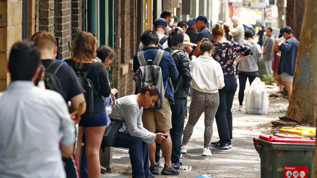 Queues of people wait outside Centrelink in March. Picture: Sam Ruttyn