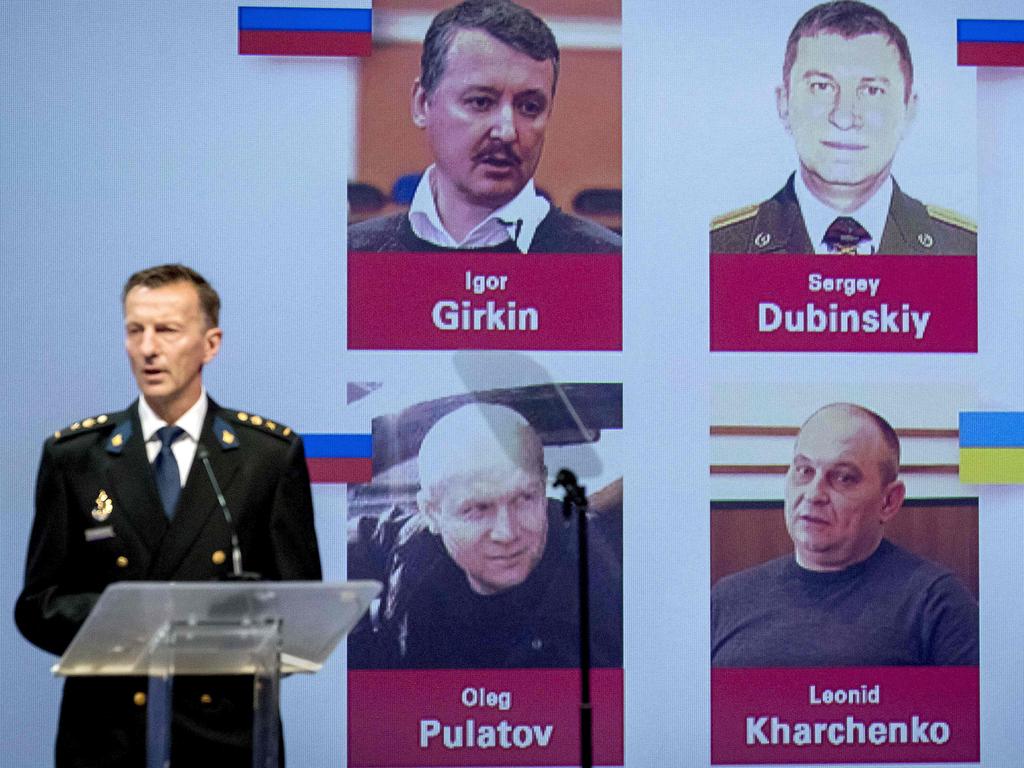 Dutch police chief Wilbert Paulissen unveils photos of the four suspects accused of murder over the downing of MH17. Picture: Robin van Lonkhuijsen / ANP / AFP