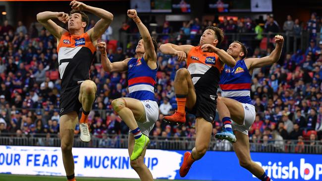 Giants pair Jeremy Cameron and Toby Greene in a marking contest with Hayden Crozier and Josh Dunkley during last year’s preliminary final Picture: AAP