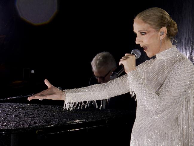 PARIS, FRANCE - JULY 26: (EDITOR'S NOTE: This Handout screengrab was provided by a third-party organization and may not adhere to Getty Images' editorial policy.) This handout released by the Olympic Broadcasting Services, shows a view of singer Celine Dion performing on the Eiffel Tower during the opening ceremony of the Paris 2024 Olympic Games Paris 2024 on July 26, 2024 in Paris, France. (Screengrab by IOC via Getty Images)