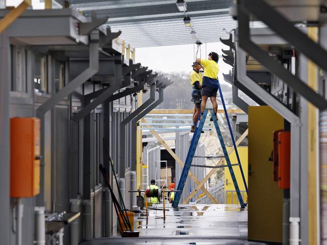 Workers put in long hours to make sure the school was ready to open. Picture: Sam Ruttyn