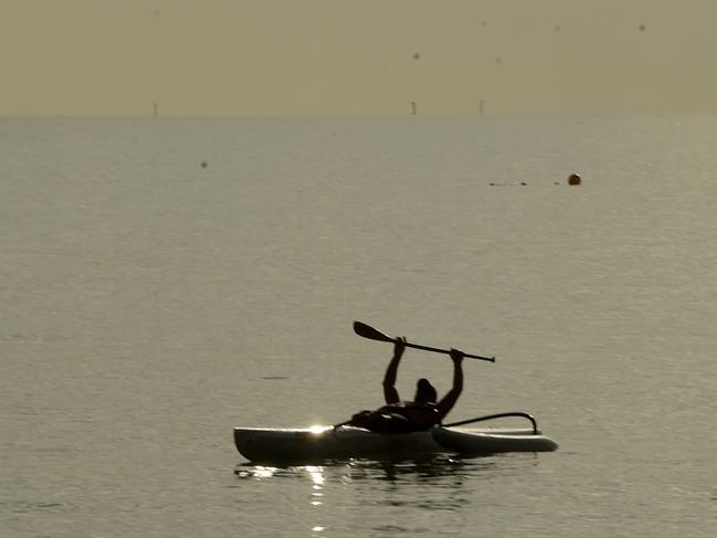 Steve Haronga enjoys an early morning paddle on the Strand. Picture: Evan Morgan