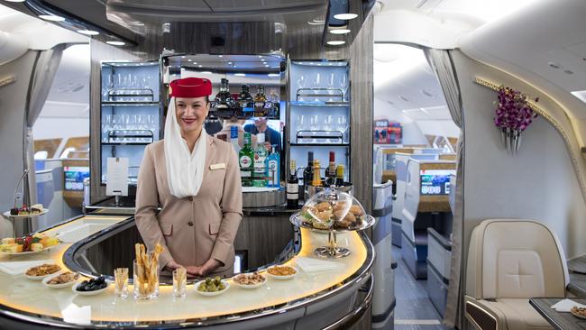 A crew member stands behind a refreshments bar in the first class cabin of an Airbus SE A380 aircraft as Emirates take delivery of their 100th A380 passenger jet in Hamburg, Germany, on Friday, Nov. 3, 2017.