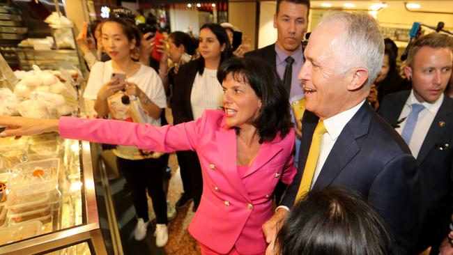 Member for Chisholm Julia Banks guides former prime minister Malcolm Turnbull through a Melbourne shopping centre earlier this year. Loyal to Mr Turnbull, Ms Banks announced this week she would step out of politics. Picture” David Geraghty / The Australian