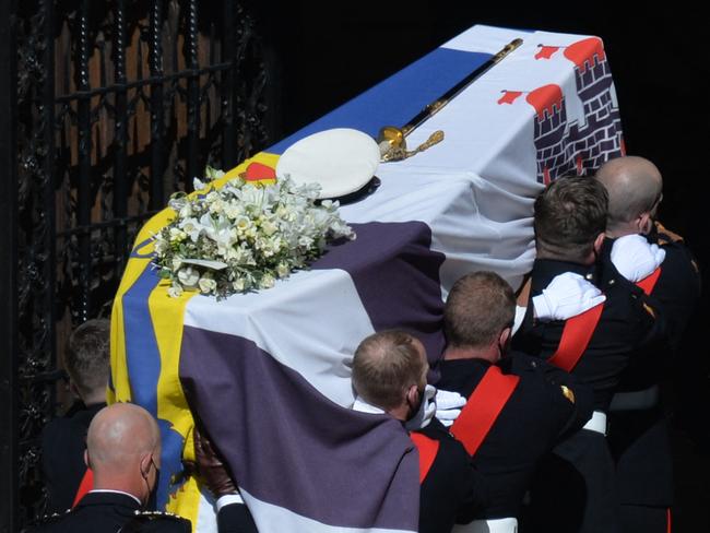 Pallbearers of the Royal Marines carry the coffin at the West Steps of St George's Chapel. Picture: Justin Tallis/AFP