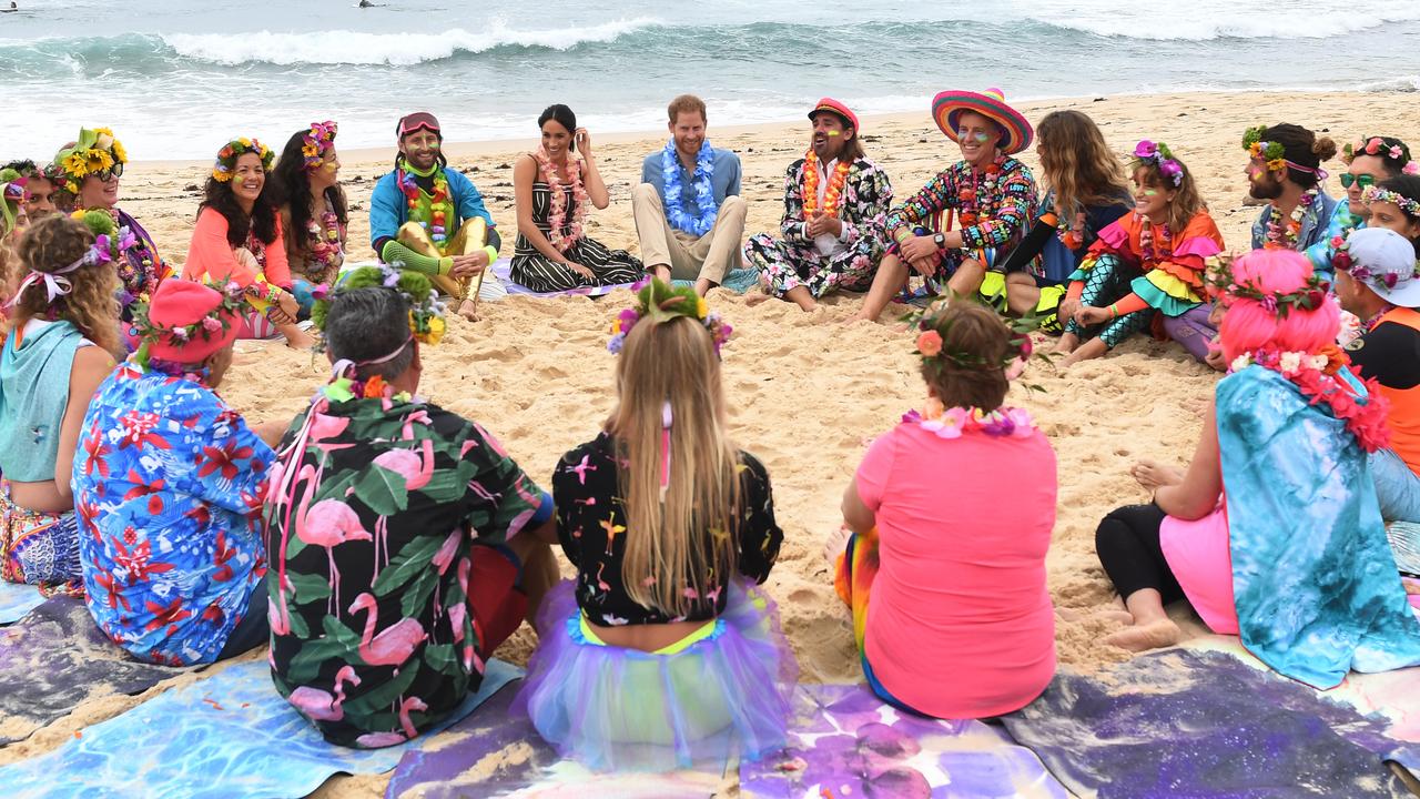 Harry and Meghan take part in a Fluro Friday session run by OneWave, a local surfing community group raising awareness for mental health and wellbeing, at Bondi Beach Picture: Dean Lewins