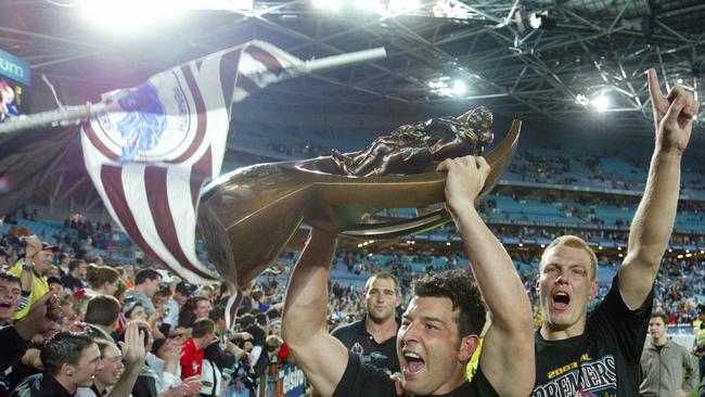 Penrith captain Craig Gower and Luke Lewis celebrate with fans after the Panthers 2003 premiership. Picture: Gregg Porteous