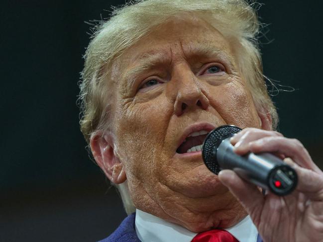 DES MOINES, IOWA - JANUARY 15: Former president Donald Trump speaks to voters during a visit to a caucus site at the Horizon Event Center on January 15, 2024 in Clive, Iowa. Iowans vote today in the stateâs caucuses for the first contest in the 2024 Republican presidential nominating process.   Kevin Dietsch/Getty Images/AFP (Photo by Kevin Dietsch / GETTY IMAGES NORTH AMERICA / Getty Images via AFP)